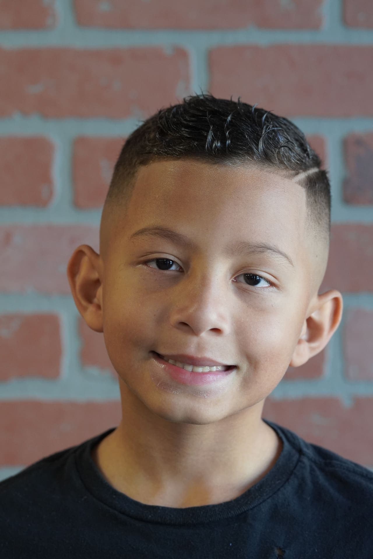 Fresh fade with styled top on young client