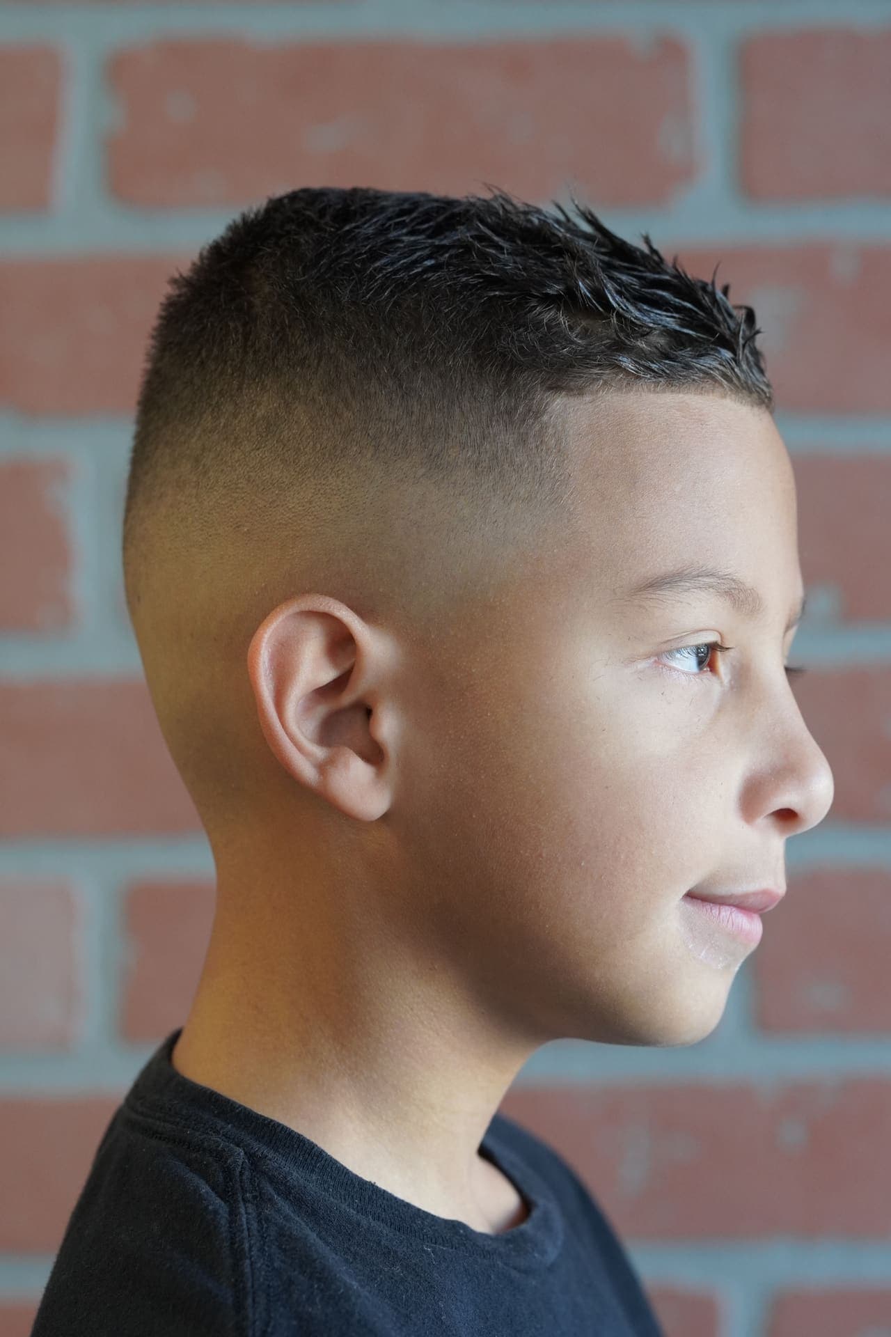 Clean skin fade side profile on young client
