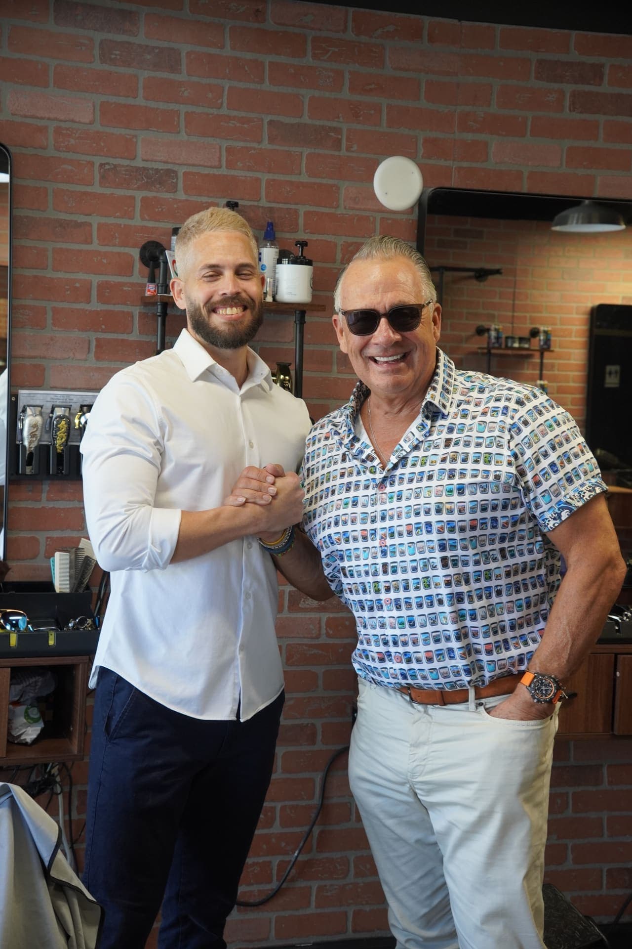 Owner and happy client posing together